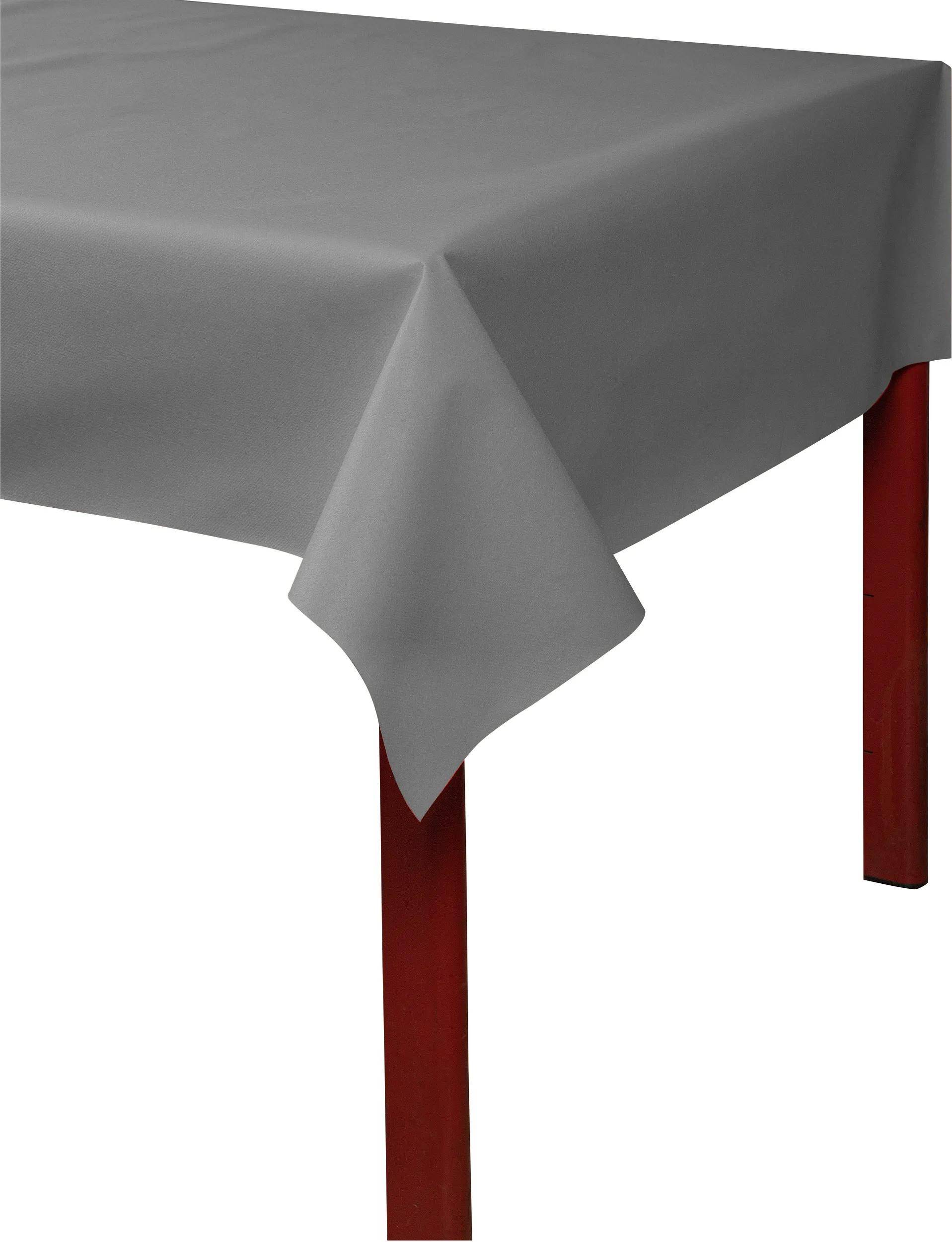 Ein Tisch mit einer grauen Tischdecke, die die Ecke und rote Beine darunter zeigt.