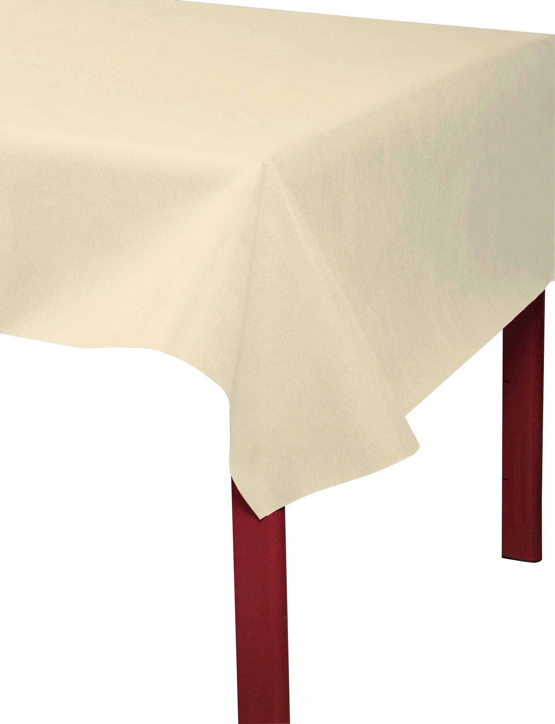 Eine Ecke eines Tisches mit einem roten Bein ist von einem cremefarbenen Tischdecken bedeckt, der über die Kanten herunterhängt.