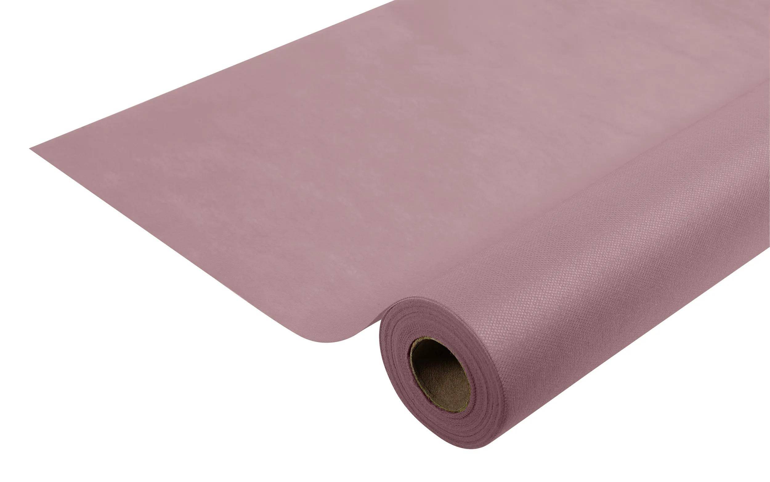 Eine rosa Yogamatte ausgerollt, die ihre Struktur und Dicke zeigt, bereit für den Einsatz bei Trainings- oder Meditationspraktiken.