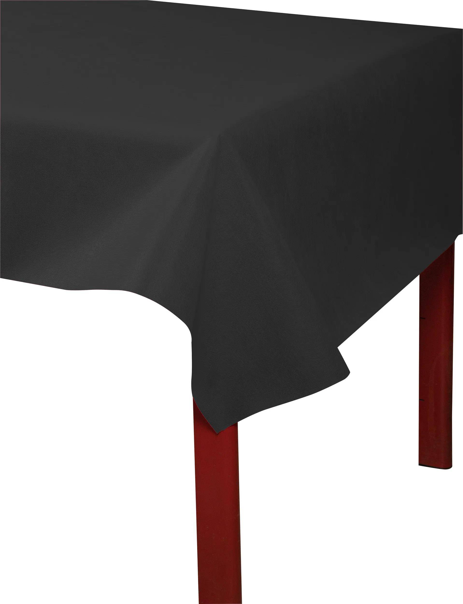 Schwarze Tischdecke, die einen Tisch mit roten Beinen bedeckt, wobei eine scharfe Eckkante zu sehen ist. Der Fokus liegt auf dem Kontrast zwischen den Farben.