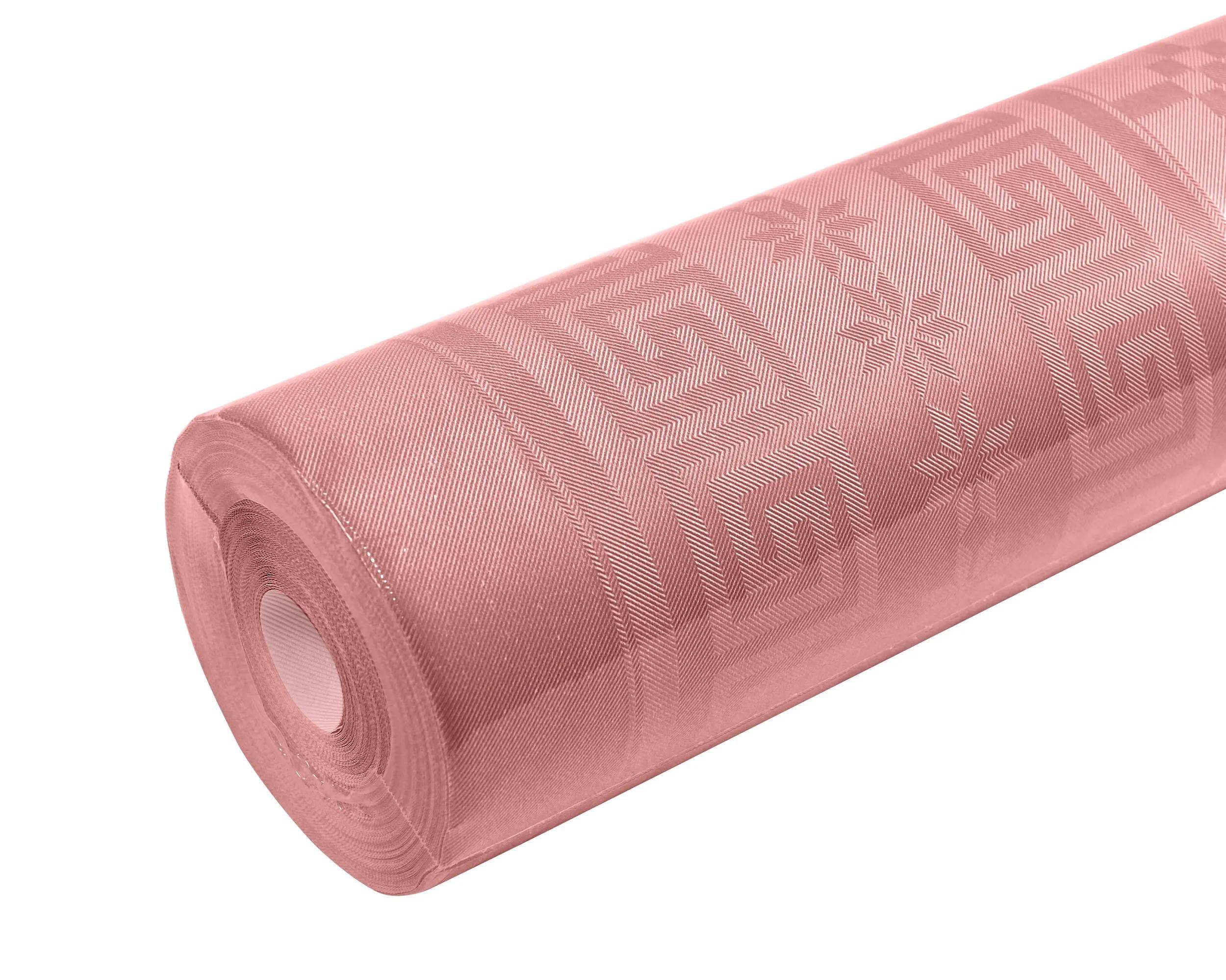 Eine Rolle rosa gemusterten Tischtuches mit geometrischen und Sternenmustern.