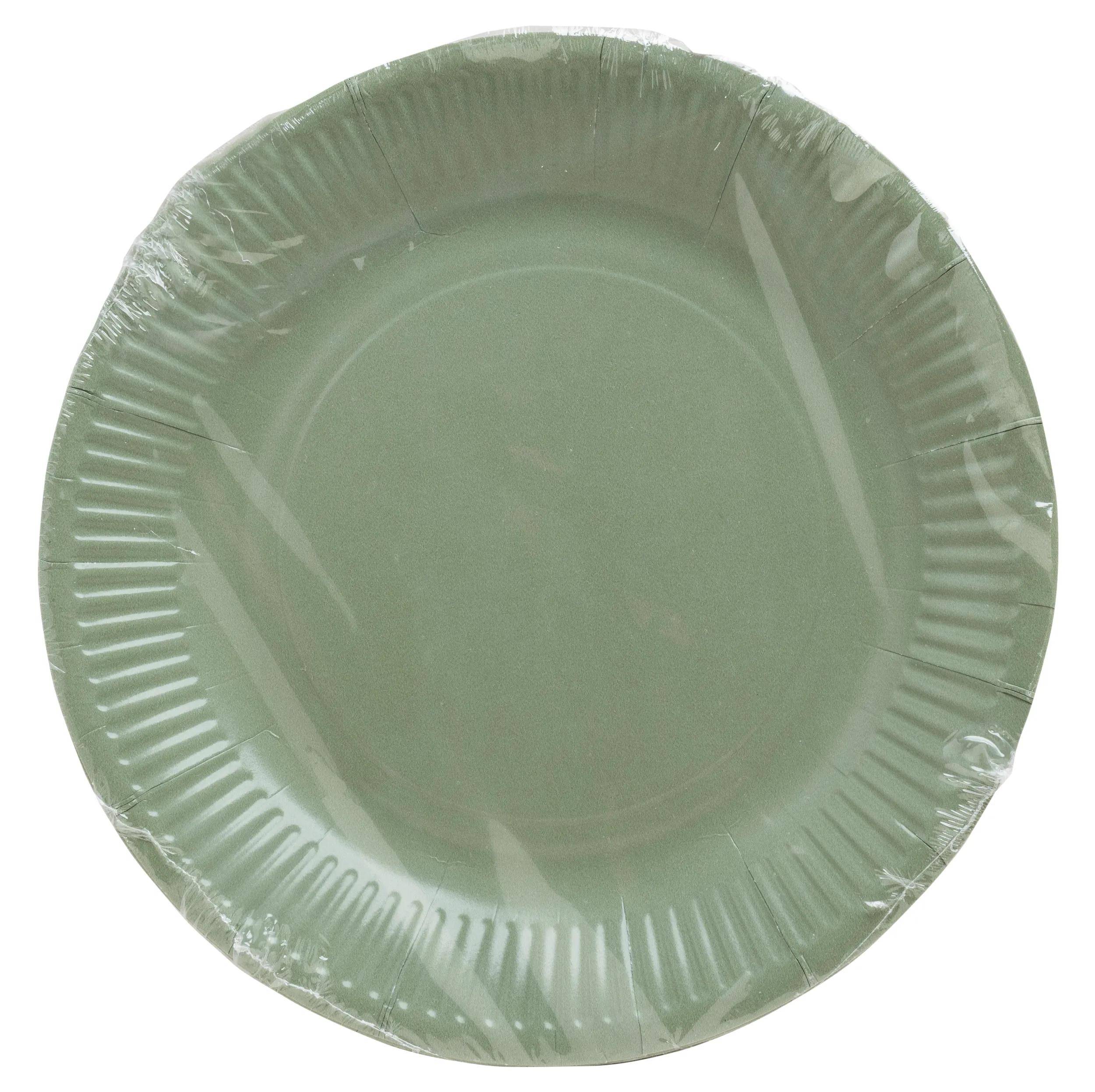 Ein runder, grüner Papierteller in transparente Plastikfolie verpackt.