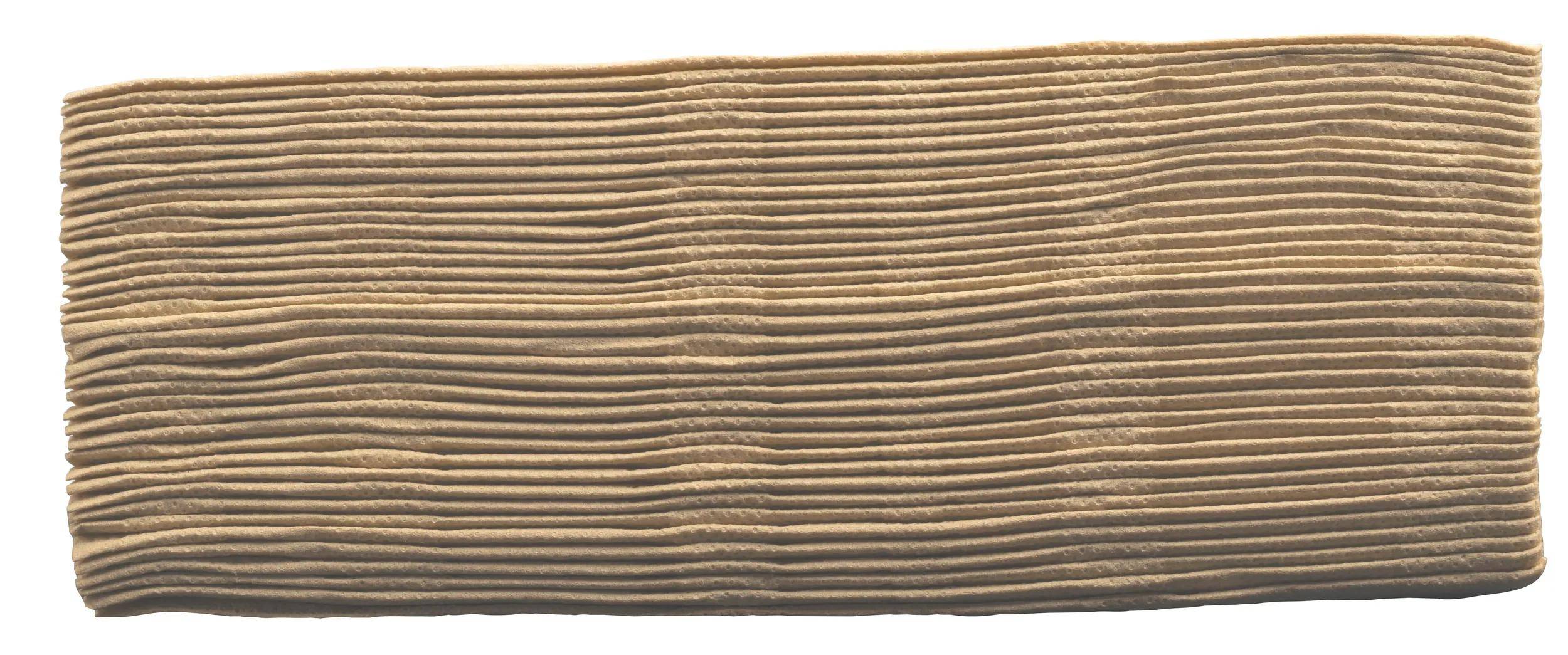 Ein Nahaufnahmebild eines Stapels von gewellten Kartonblättern, das die wellige Textur und die gleichmäßige Schichtung zeigt.