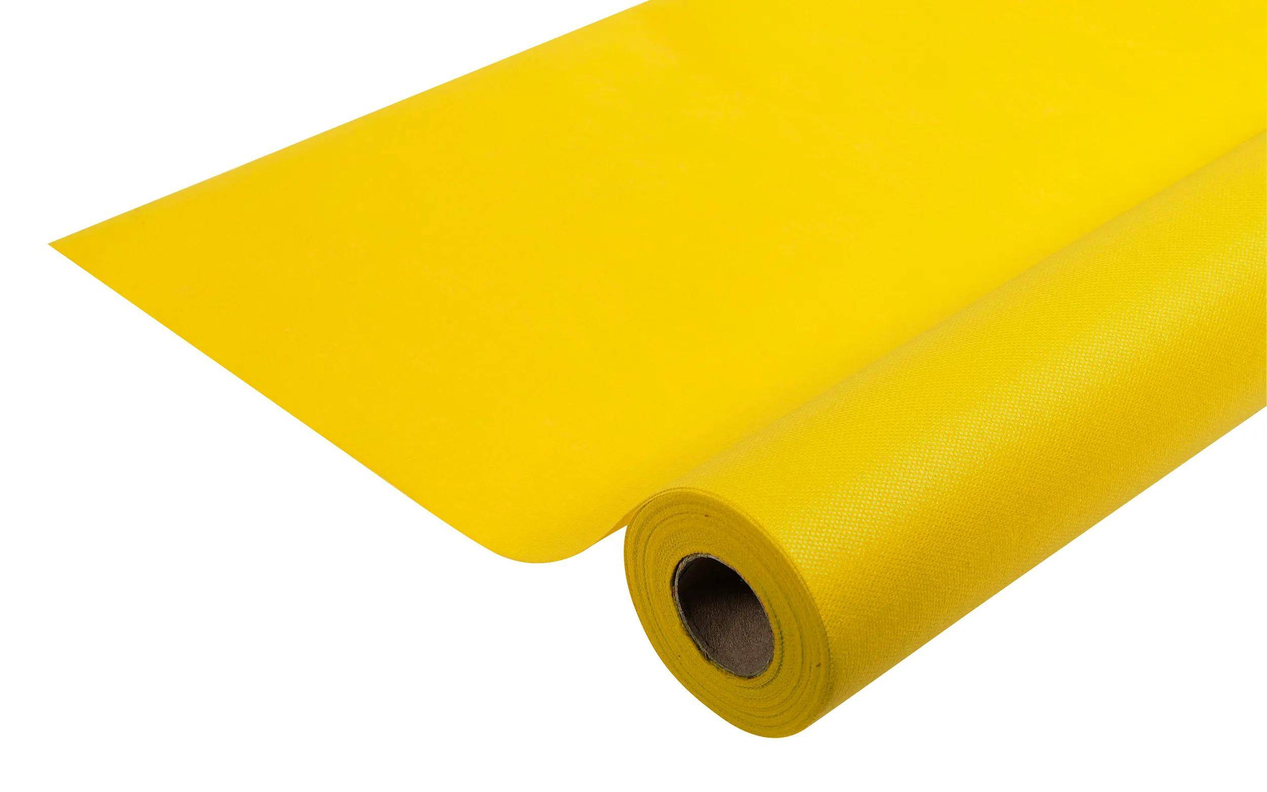 Eine leuchtend gelbe Yogamatte, teilweise ausgerollt, zeigt ihre Textur und ihren aufgerollten Kern.