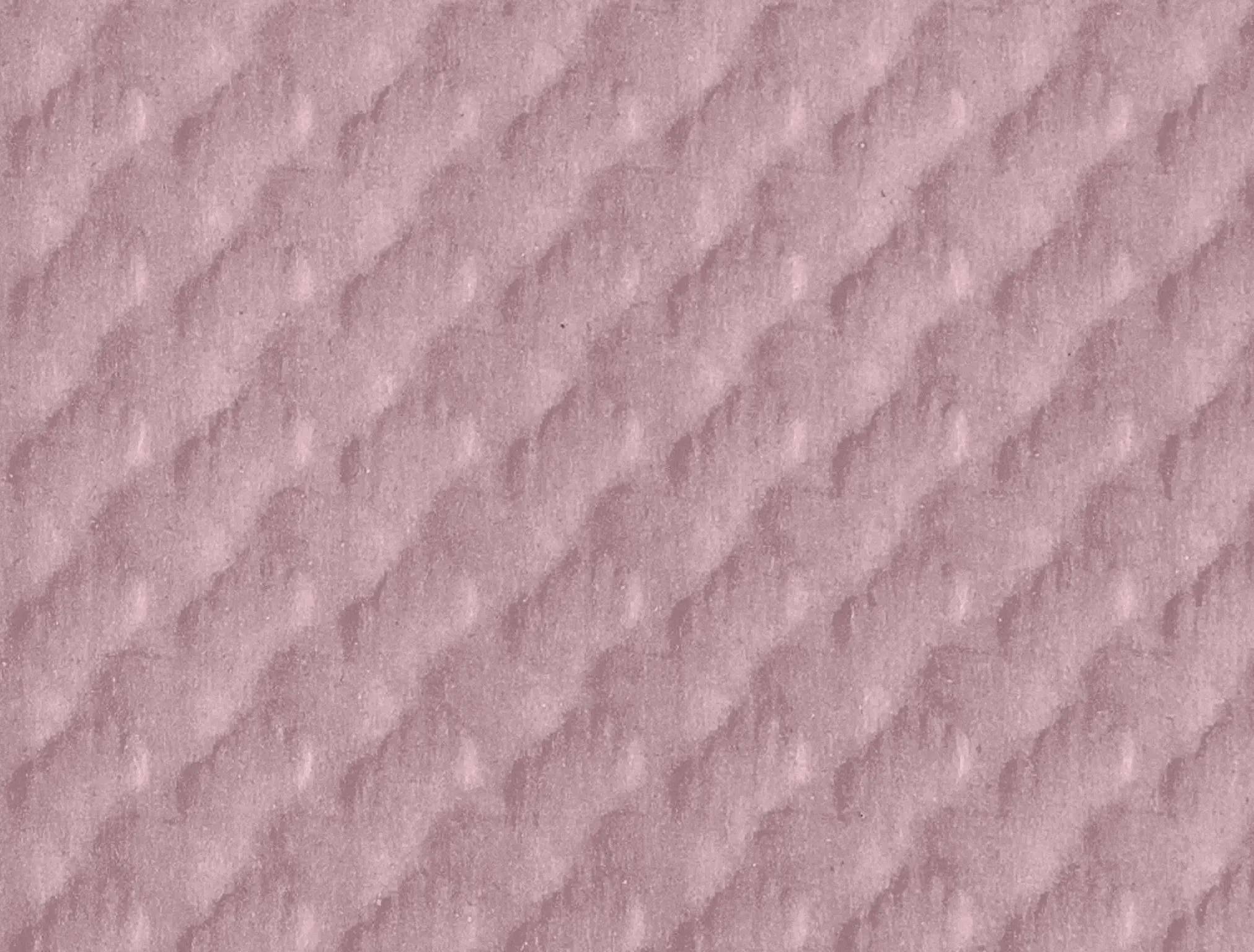 Eine Nahaufnahme der Textur von rosa gestepptem Stoff, die ein Diamantmuster mit erhobenen, weichen Merkmalen zeigt.