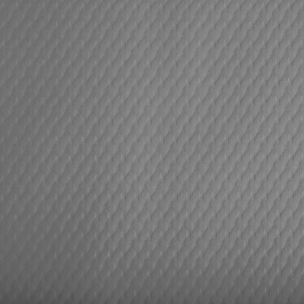 Eine Nahaufnahme einer strukturierten hellgrauen Oberfläche mit einem Rautenmuster.