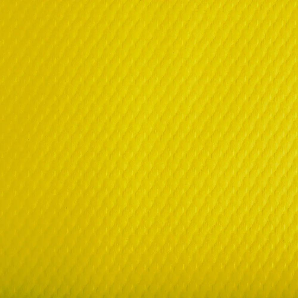 Eine Nahaufnahme einer strukturierten gelben Oberfläche mit einem kleinen Rautenmuster.