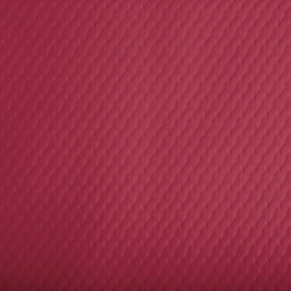 Eine Nahaufnahme einer strukturierten roten Oberfläche mit einem sich wiederholenden Muster aus Rautenformen.