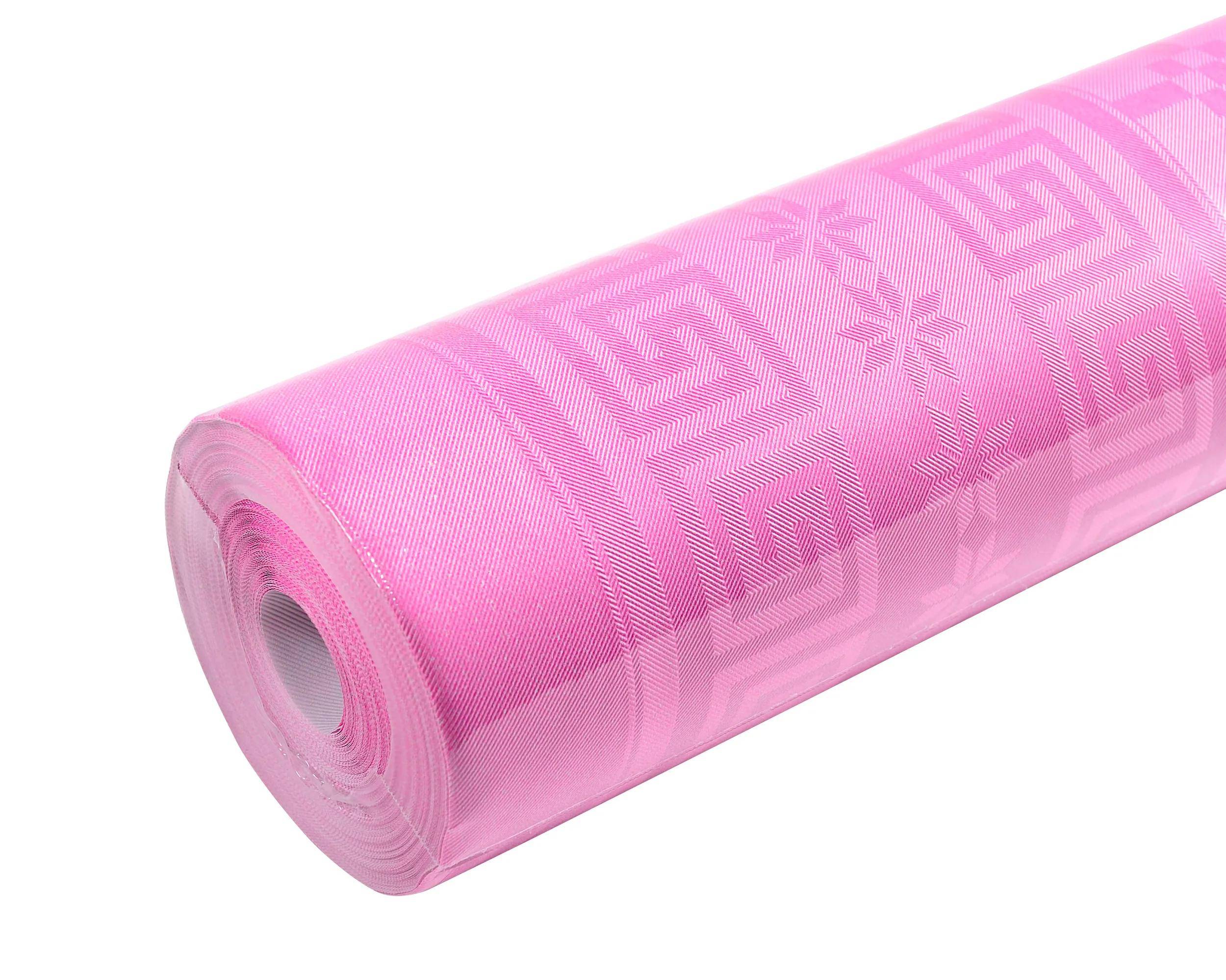 Ein gerollter, rosa Dekorationsstoff mit geometrischen und floralen Mustern, geeignet zum Basteln, für Polsterung oder Veranstaltungsdekoration.