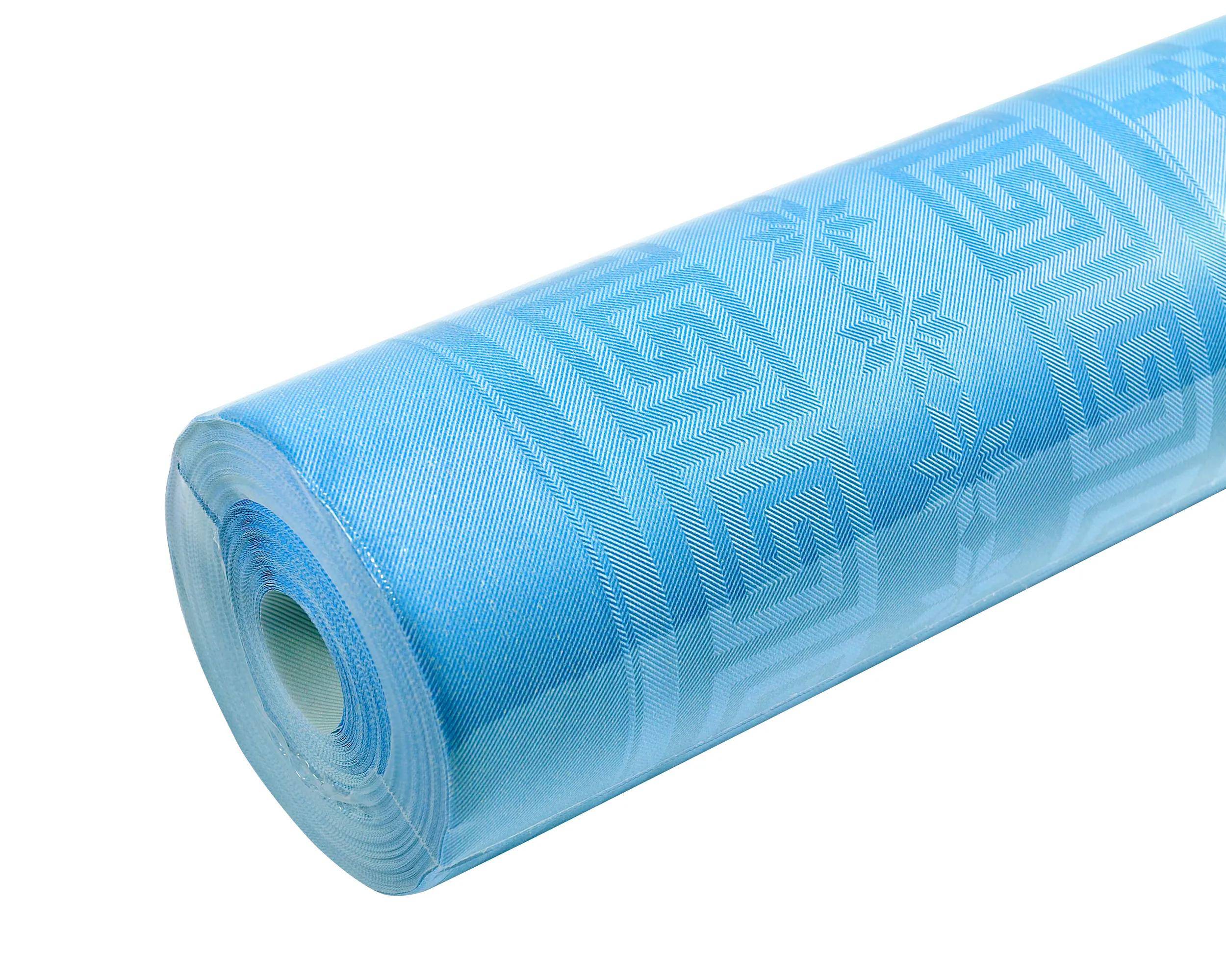 Eine Rolle blauem Jacquardstoff mit geometrischem Muster aus Spiral- und Sternformen, das Textur und detailliertes Design zeigt.