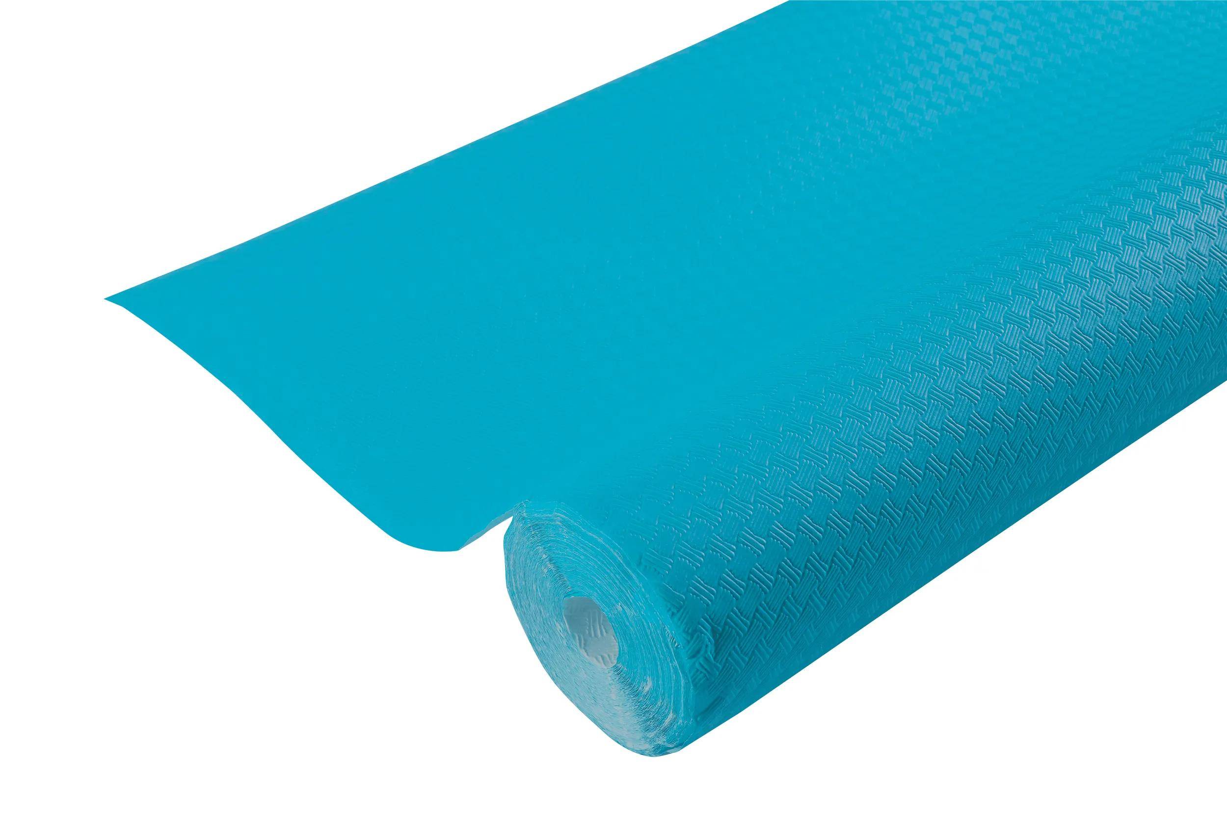 Eine blaue Schaumstoff-Rollmatte, teilweise ausgerollt, mit einem strukturierten Muster.
