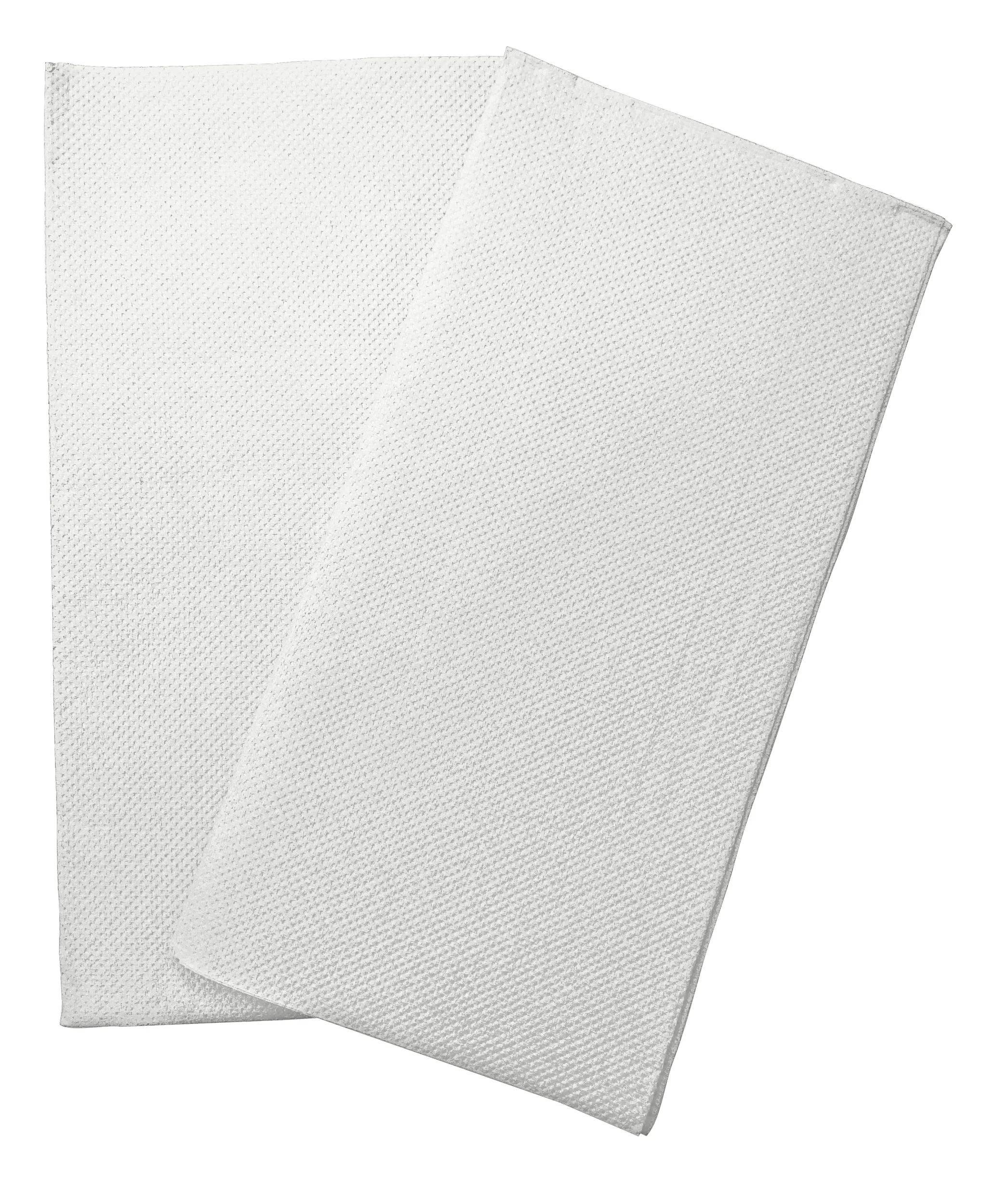 Zwei weiße strukturierte Handtücher ordentlich gestapelt, die ein sauberes und minimalistisches Erscheinungsbild bieten.