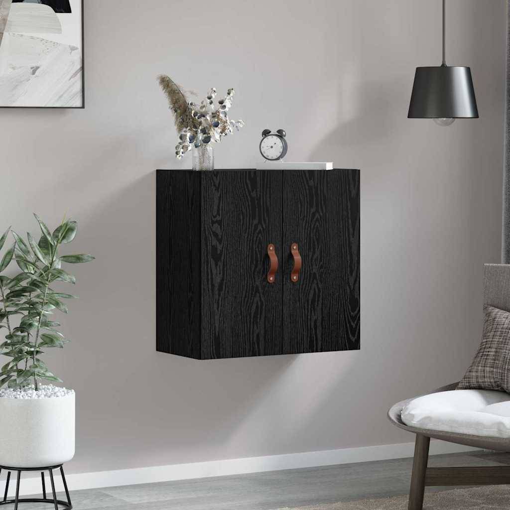 Ein moderner Wohnraum mit einem an der Wand montierten Holzschrank, einer dekorativen Pflanze und einer Tischlampe, der eine minimalistische und gemütliche Atmosphäre ausstrahlt.