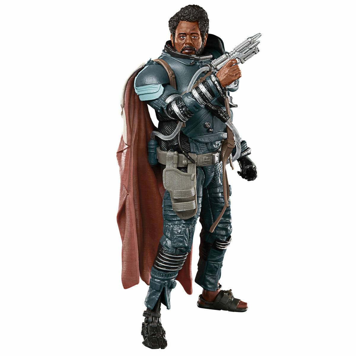 Eine Science-Fiction-Actionfigur eines Mannes in Rüstungsausrüstung mit einem roten Umhang, der eine futuristische Pistole gegen einen weißen Hintergrund hält.