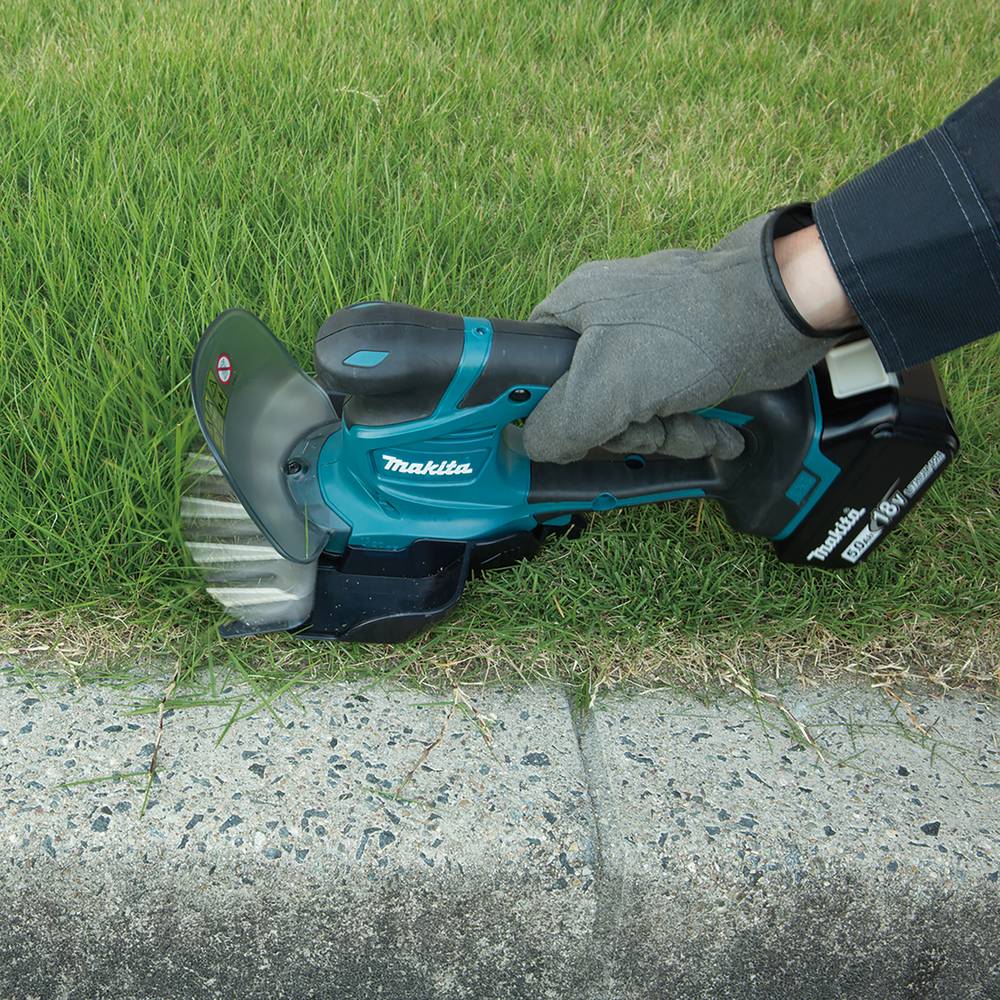Makita Akku-Grasschere 18V DUM604SZ + SCHWÄBLE® Schaumseinlage + MAKPAC