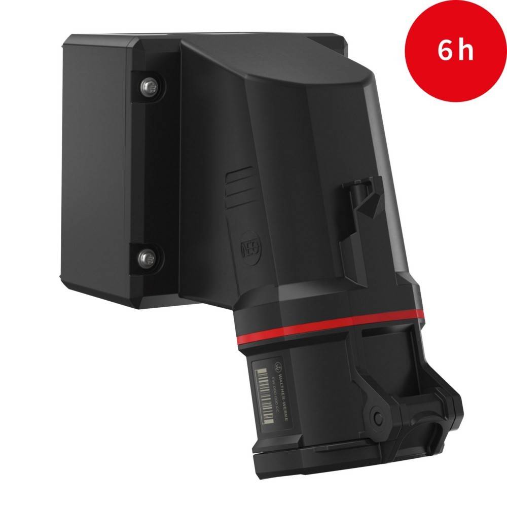 Ein schwarzes Gerät mit kompaktem, eckigem Design ist an einer Wand befestigt. Ein roter Kreis in der Ecke zeigt '6h' an, was auf Batterielaufzeit oder Dauer hinweist.