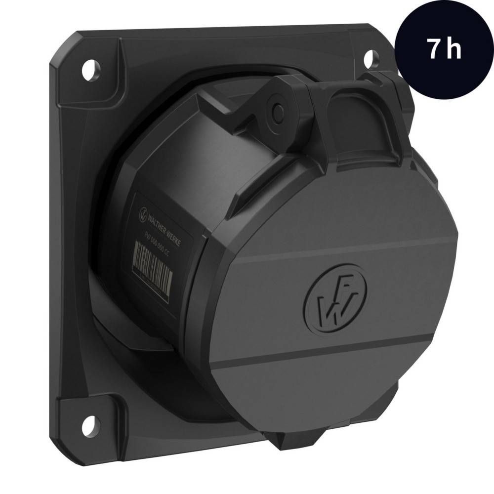 Schwarze kreisförmige Wandmontage-Vorrichtung mit vier Eckschrauben und einem kleinen Etikett.