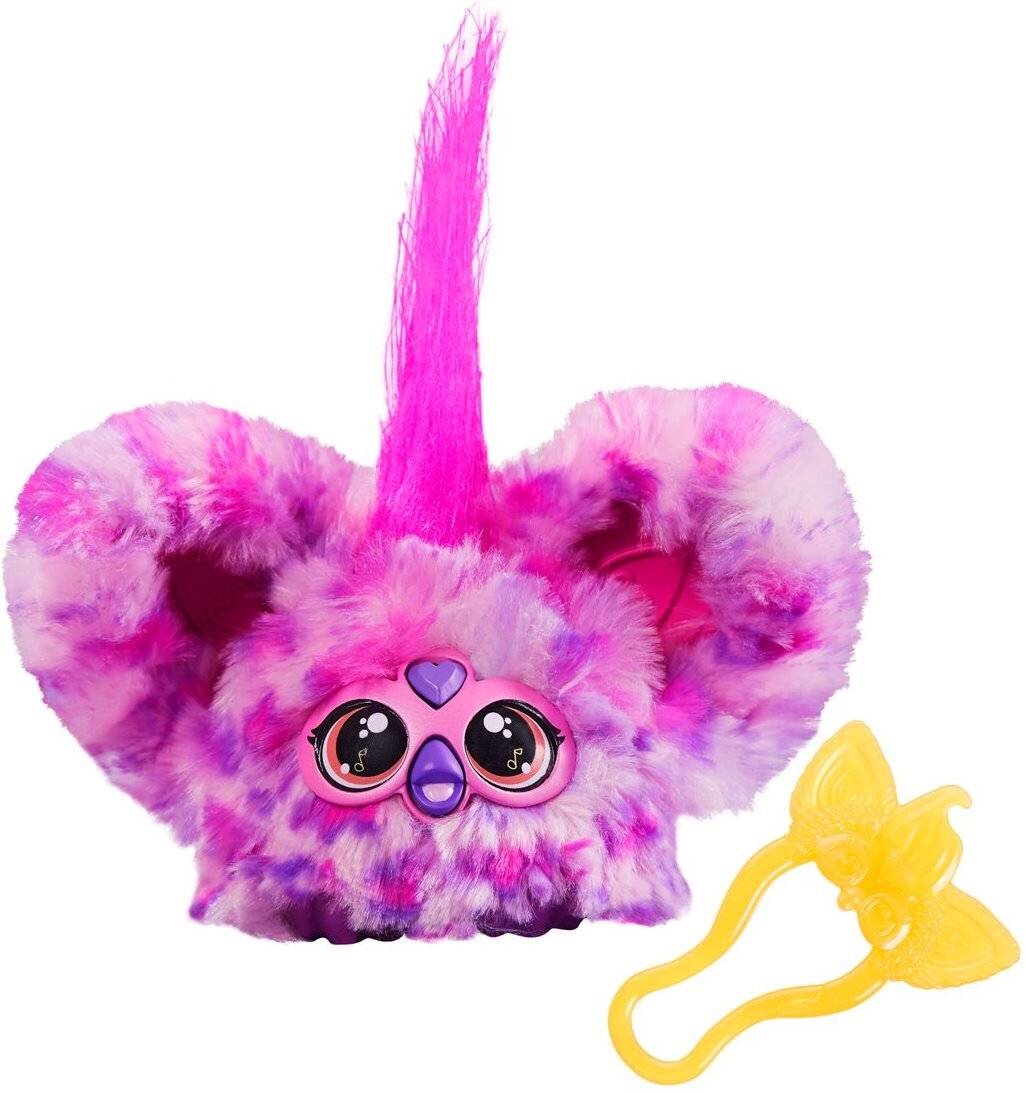 Niedliches, flauschiges rosa Spielzeugwesen mit großen Augen und großen Ohren, gekrönt von einem Haarbüschel aus rosa Fell. Inklusive eines gelben, schmetterlingsförmigen Accessories.