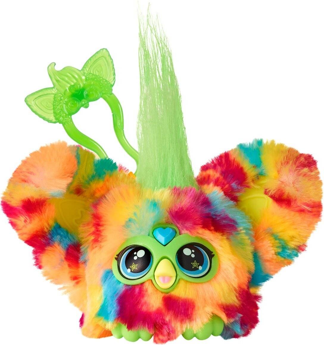 Eine bunte Spielzeugfigur mit grünen Ohren und Haaren, großen Augen und mehrfarbigem Fell.