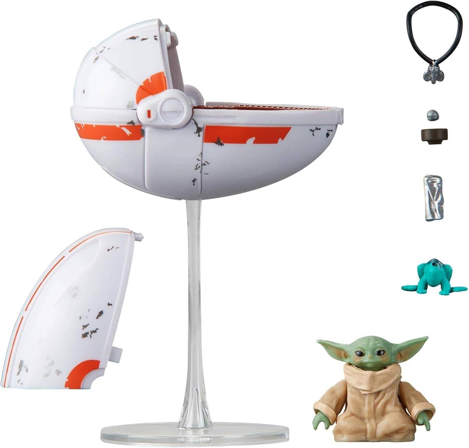 Ein Star Wars Grogu-Pod-Stuhl auf einem Ständer, dargestellt mit offener Ausführung und abgetrenntem Seitenpaneel sowie kleinen Zubehörteilen und einer Grogu-Figur daneben.