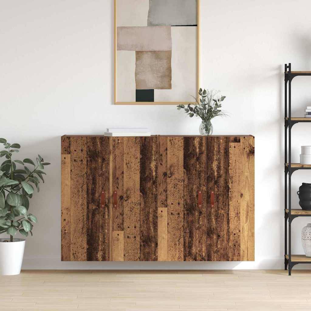Ein Holzschrank mit rustikaler Oberfläche ist zentral platziert, mit abstrakter Kunst darüber und Pflanzen zu beiden Seiten, vor einer weißen Wand.