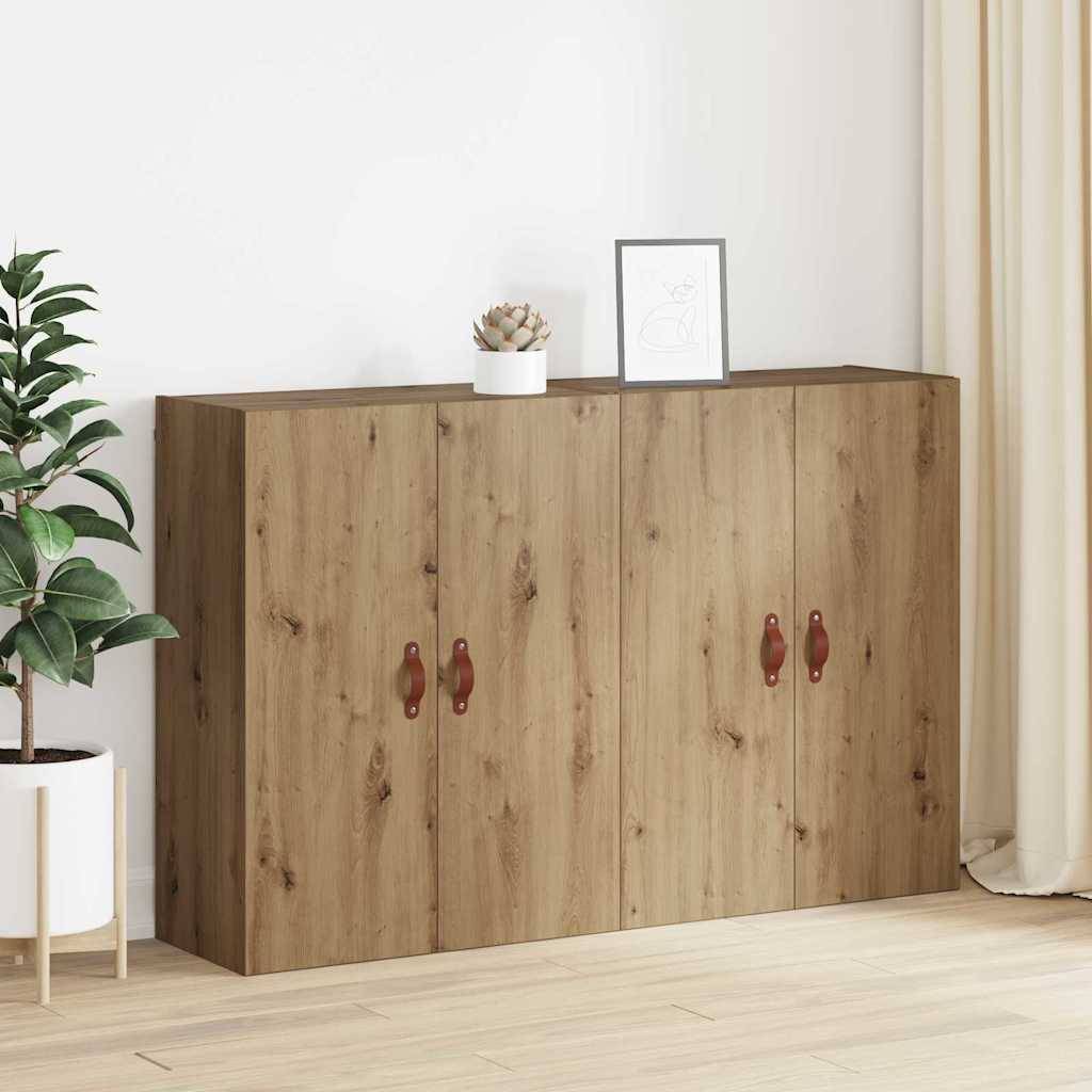Ein hölzernes Sideboard mit vier Türen und runden Griffen steht an einer beigen Wand. Eine kleine Pflanze und ein gerahmtes Bild befinden sich darauf.