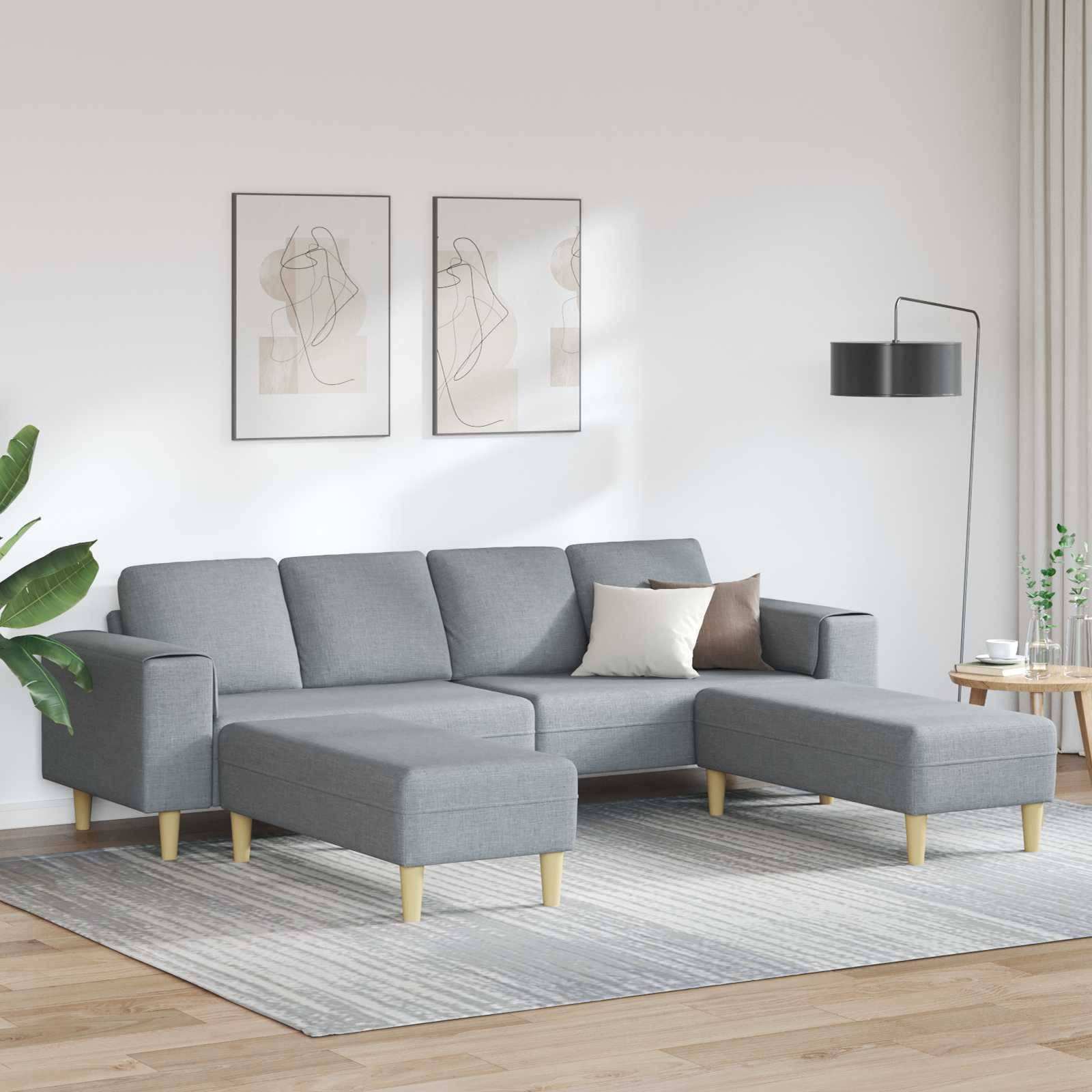 Ein moderner Wohnraum mit einem grauen Ecksofa, zwei abstrakten Wandkunstwerken, einer Stehlampe und einer Pflanze. Eine gemütliche, minimalistische Atmosphäre.