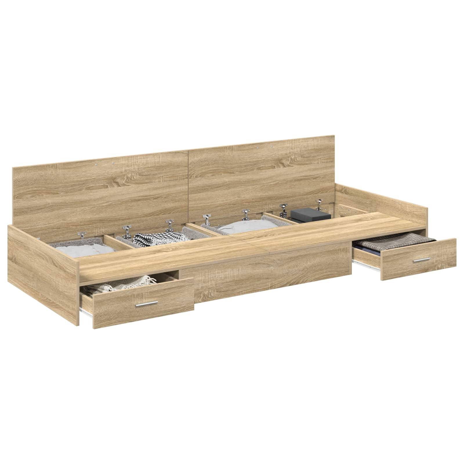 Ein Holzbettgestell mit integriertem Kopfteil und drei ausziehbaren Aufbewahrungsschubladen darunter, wobei jede Schublade gefaltete Kleidungsstücke enthält.