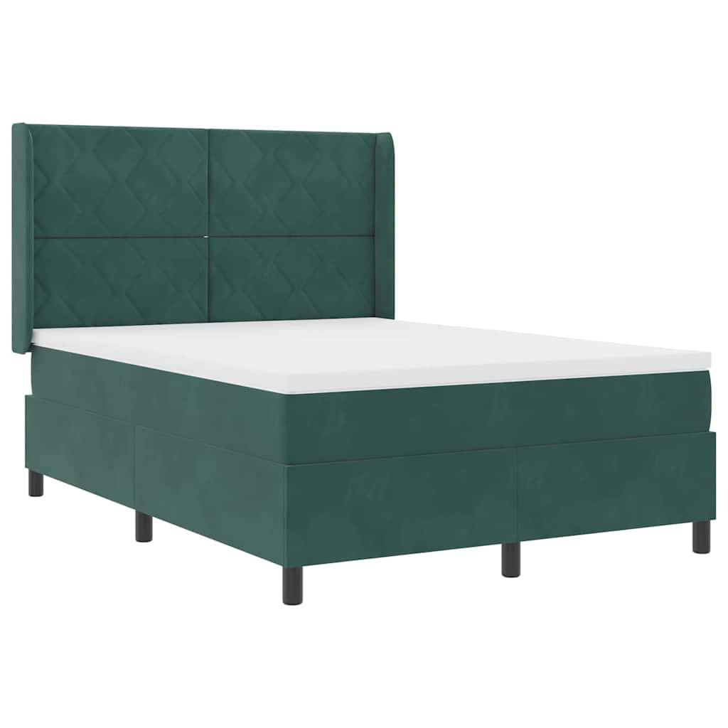 Ein grün gepolstertes Bett mit gepolstertem Kopfteil und schlichtem Design, das eine weiße Matratze oben trägt.