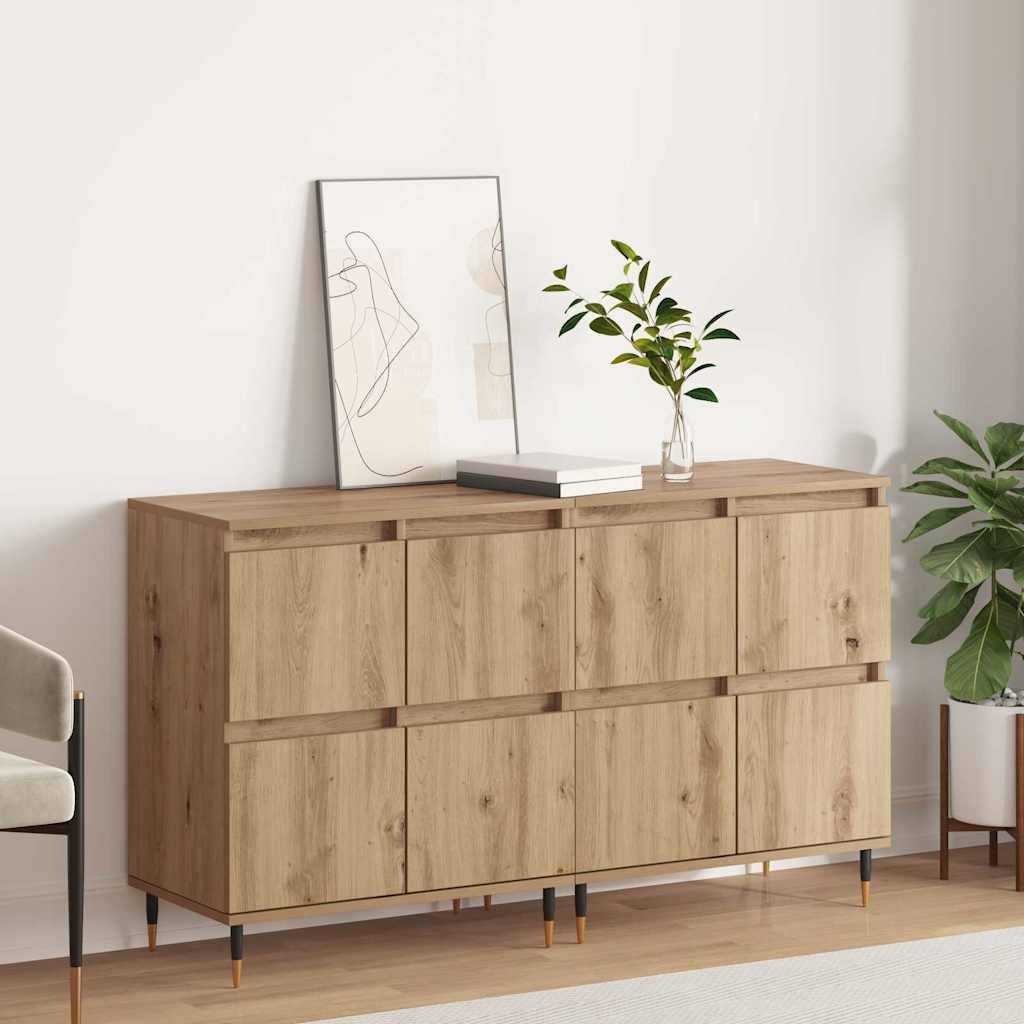 Ein Holz-Sideboard mit Pflanzen und Büchern oben steht an einer weißen Wand. Ein minimalistischer Kunstrahmen lehnt an dem Sideboard.