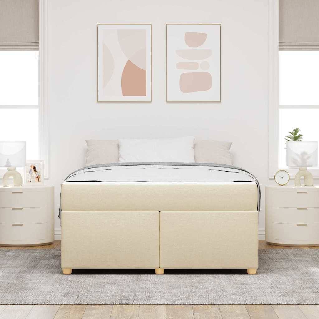 Ein ordentlich gemachtes Bett mit beigefarbener Basis, weißer Bettwäsche und einer grauen Decke ist zwischen zwei runden Nachttischen zentriert. Kunstwerke hängen darüber.