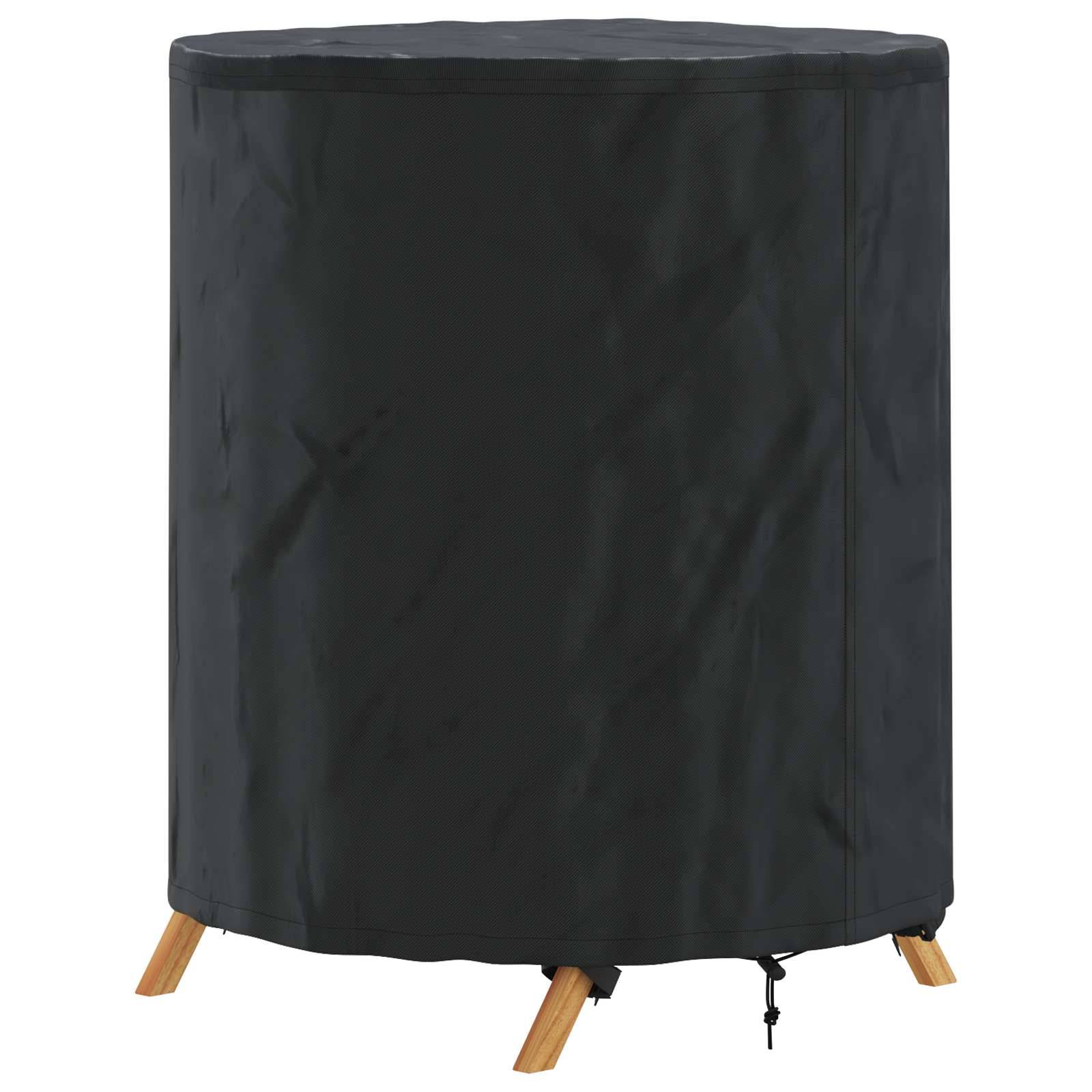 Eine schwarze, zylindrische Abdeckung für einen Outdoortisch mit Holzbeinen, die unten hervorschauen, die einen runden Tisch vollständig zur Schutz verhüllt.