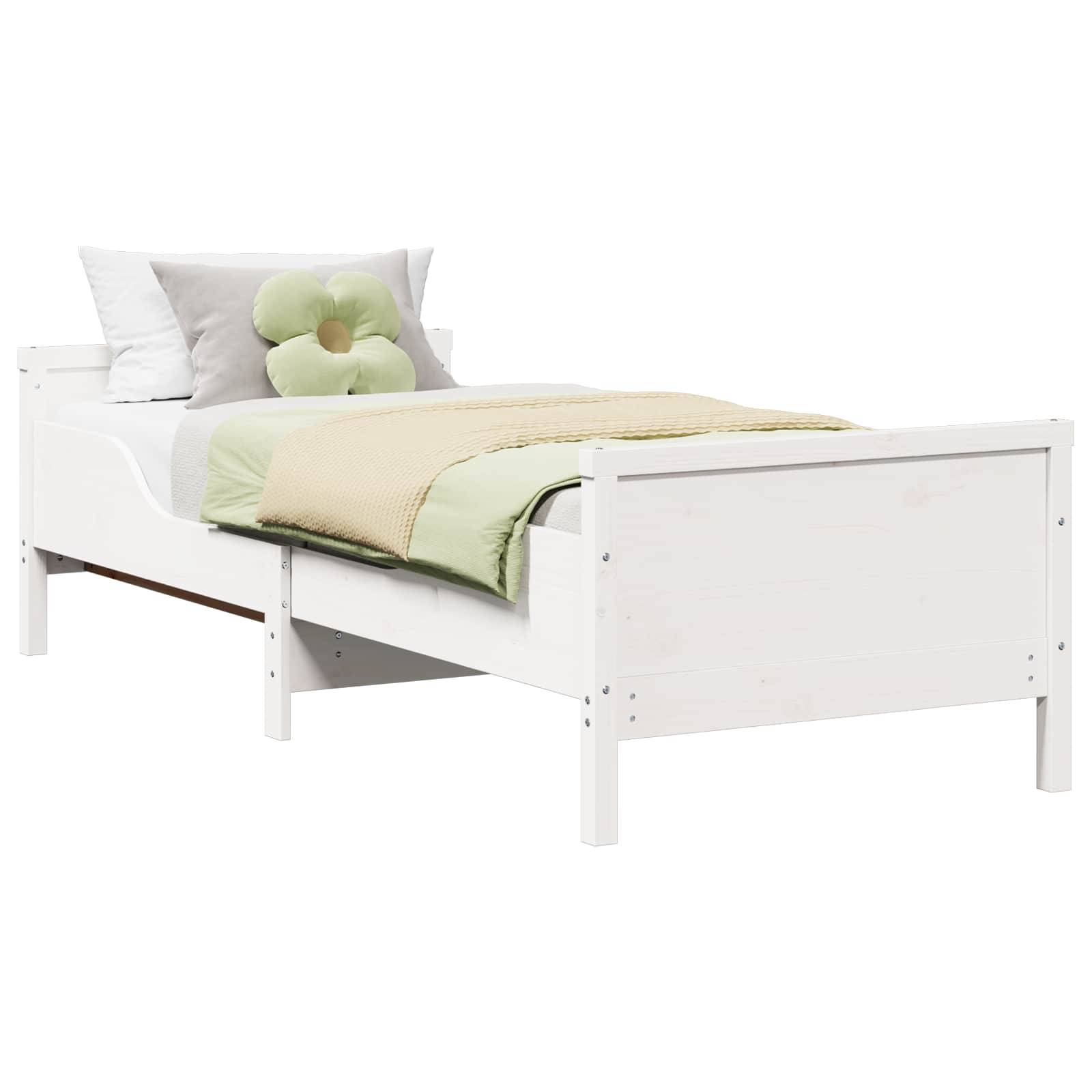 Weiches Einzelbett mit Kopfteil, Kissen und grüner Bettwäsche auf weißem Hintergrund.