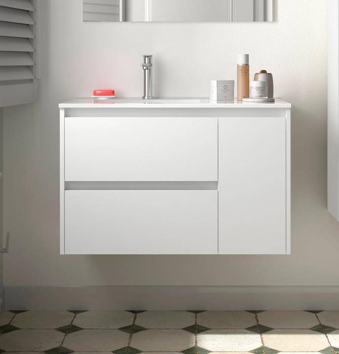 Modernes weißes Badezimmerwaschtisch mit integriertem Waschbecken, Armatur und Toilettenartikeln auf einem wandmontierten Schrank über gefliester Bodenfläche mit Muster.