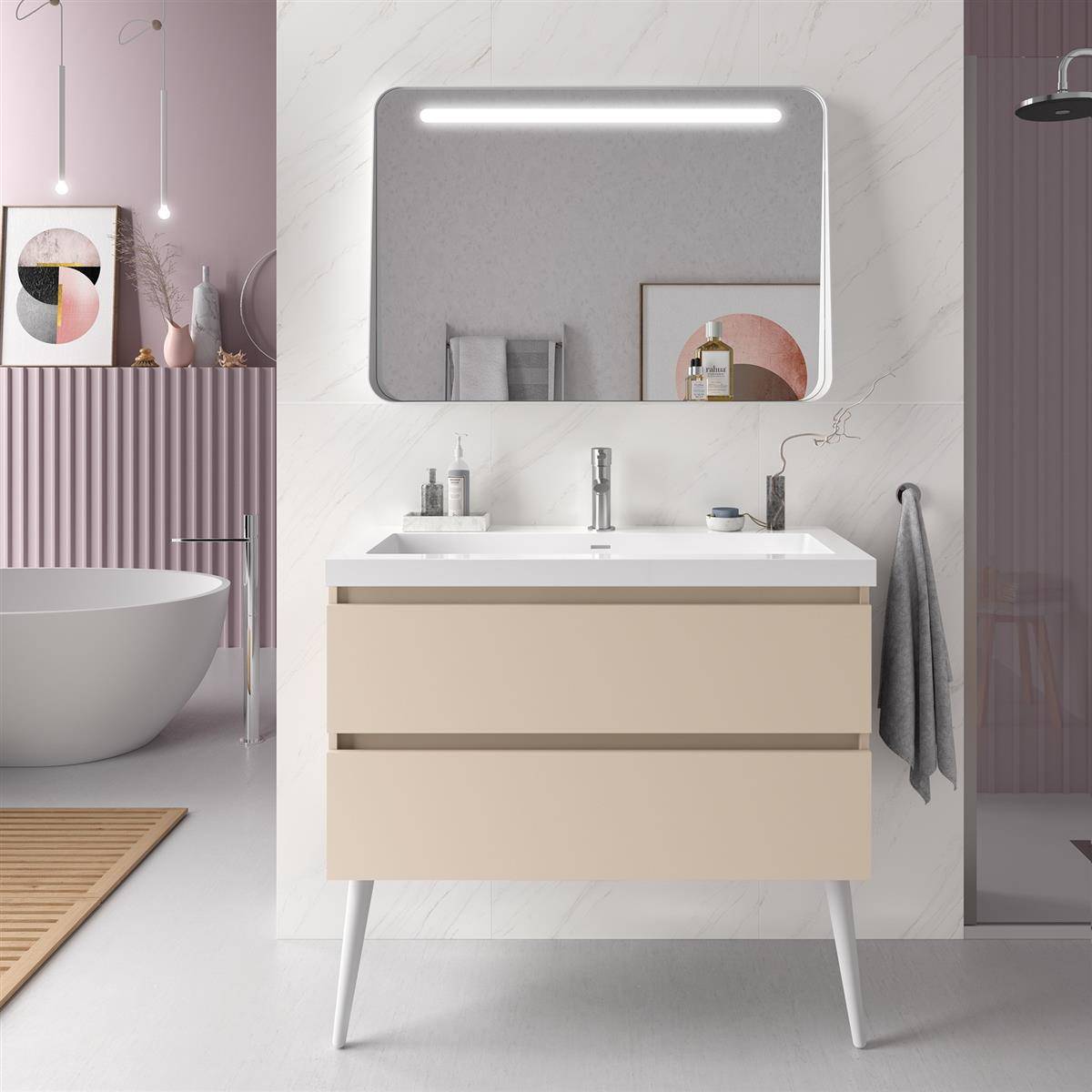 Modernes Badezimmerwaschtisch mit beleuchtetem Spiegel, beigem Schrank auf Beinen, weißer Arbeitsplatte und angrenzendem Badewanne in einem sanften Rosa-Grau-Interieur.