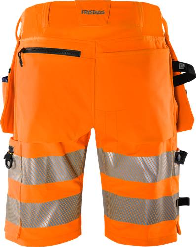 Eine Hose in leuchtendem Orange für Bauarbeiten mit reflektierenden silbernen Streifen, entwickelt für hohe Sichtbarkeit und Sicherheit in Arbeitsumgebungen.