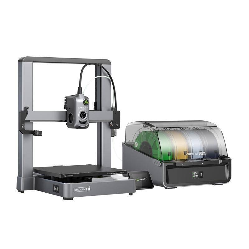 Ein 3D-Drucker und eine Filament-Aufbewahrungsbox. Der Drucker verfügt über einen robusten Rahmen und eine Düse, während die Aufbewahrungsbox mehrere Filamentspulen beherbergt.