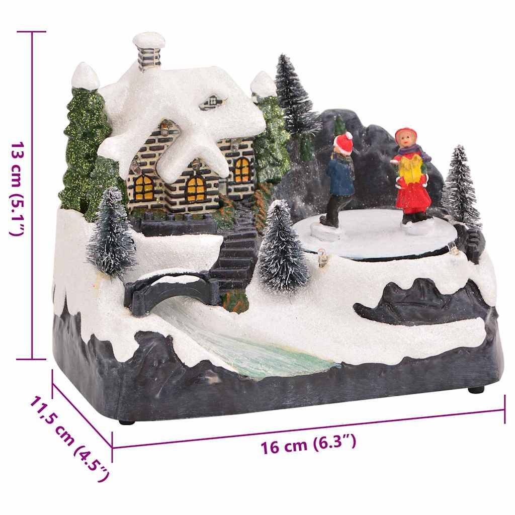 Dekoratives Schneeszenenbild mit einer Hütte und zwei Figuren auf Eis. Maße: 13 cm hoch, 11,5 cm breit, 16 cm lang.