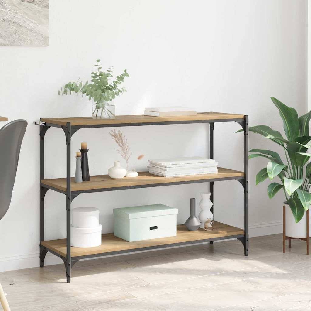 Ein hölzernes Regal mit schwarzem Metallrahmen trägt Pflanzen, Bücher und Dekorationsgegenstände in einem Wohnzimmer mit hellen Wänden und Boden.