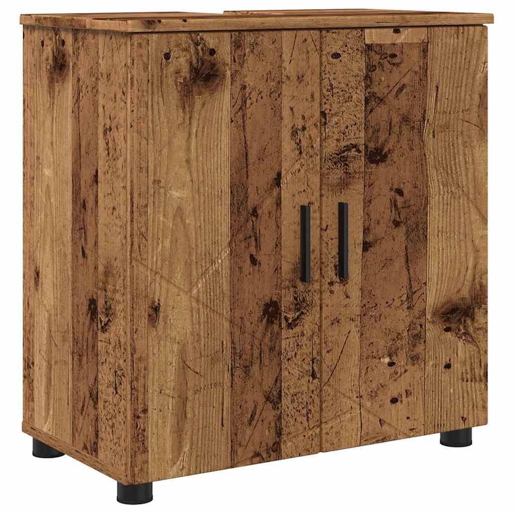 Ein Holzschrank mit zwei Türen, ausgestattet mit einem rustikalen, verwitterten Finish und schwarzen Griffen, steht auf kleinen schwarzen Beinen.