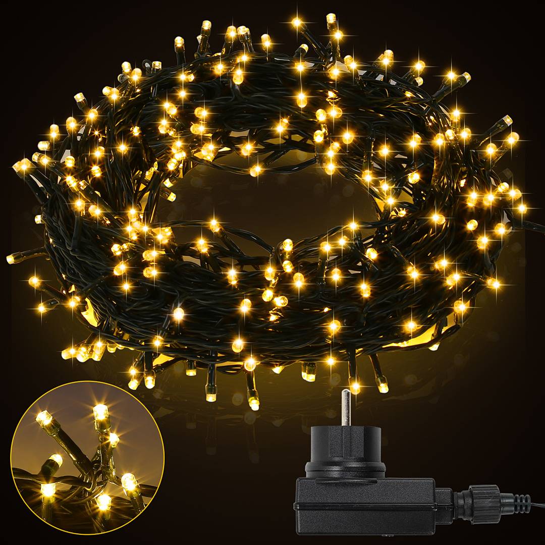 Nahaufnahme einer eingesteckten Spule von warmweißen Feenlichtern, die gegen einen dunklen Hintergrund leuchten, mit einer kleinen Einblendung, die die LED-Lampen zeigt.