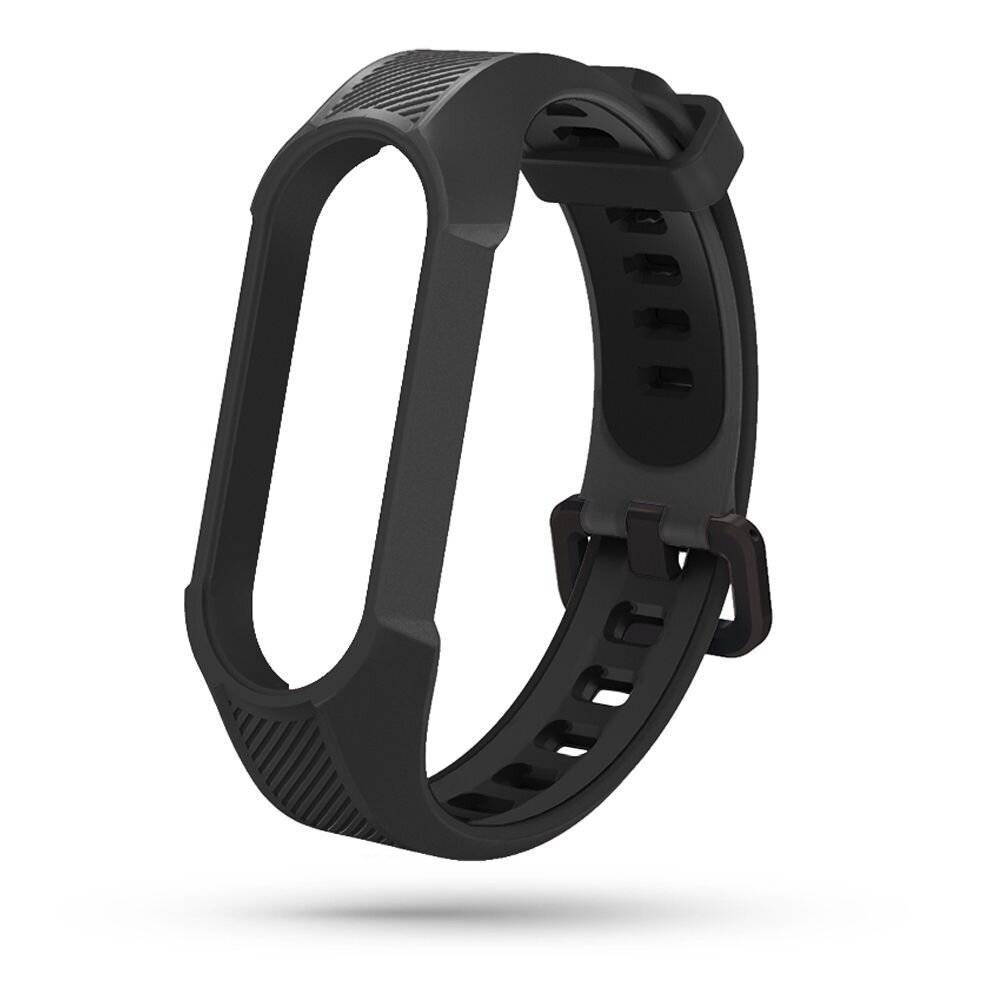 Ein schwarzes Silikon-Armband für einen Fitness-Tracker oder Smart-Band, mit verstellbarem Riemen und mehreren Löchern zur Größenanpassung.