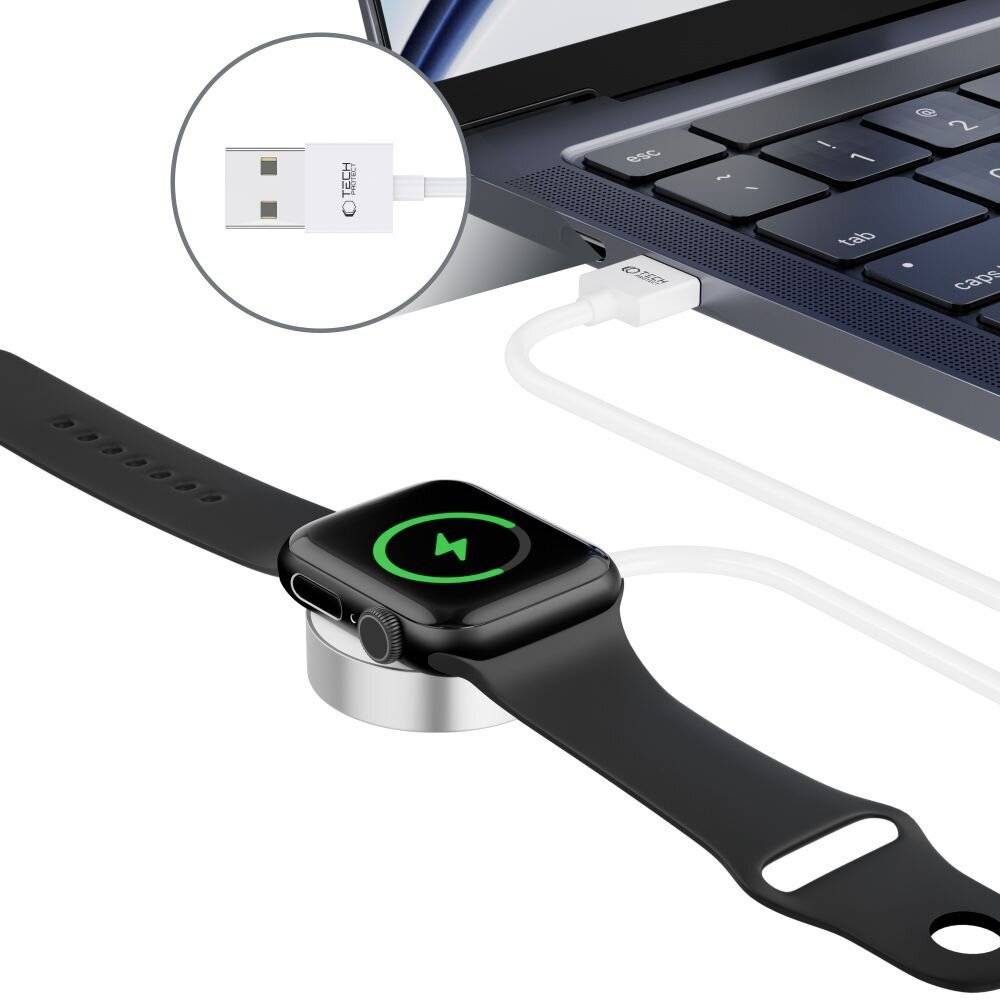 Eine digitale Uhr, die über ein magnetisches USB-Ladekabel mit einem Laptop verbunden ist und die kabellose Ladefunktionalität veranschaulicht.