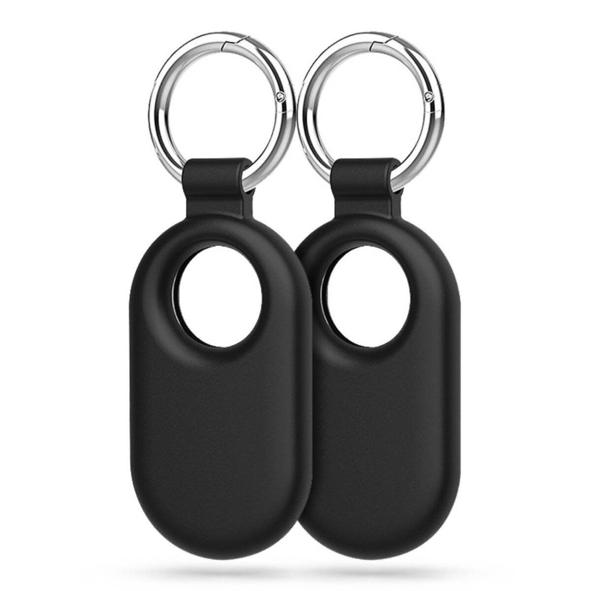 Zwei schwarze Schlüsselanhänger-Halterungen, die zum Befestigen kleiner Tracking-Geräte konzipiert sind, mit kreisförmigen Ausschnitten und silbernen Metallringen.