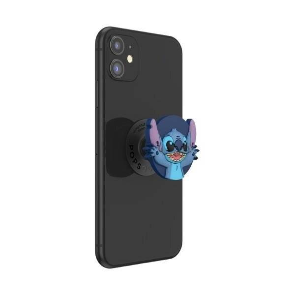 Ein Smartphone mit einem charakterthematischen Pop-Socket, das auf seiner Rückseite angebracht ist und ein lächelndes blaues Alien-Wesen mit großen Ohren zeigt.