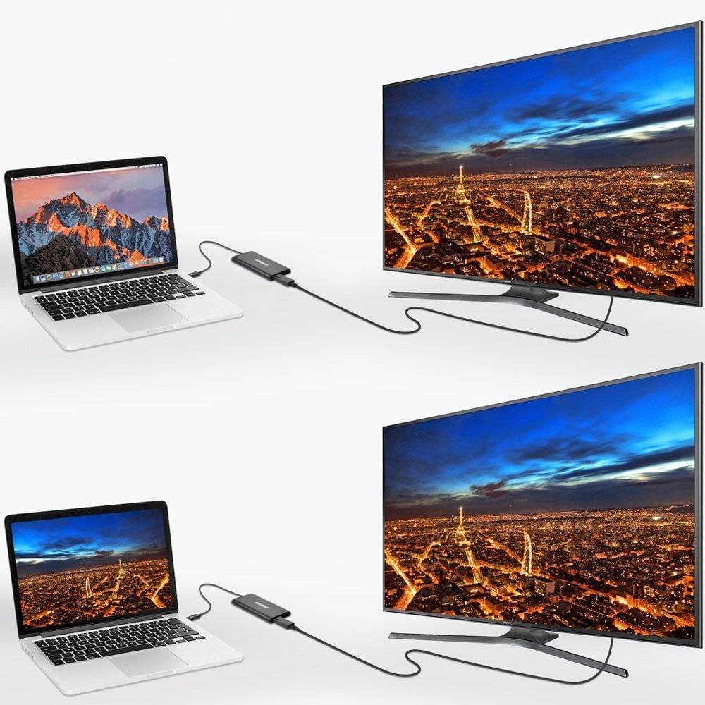 Ein Laptop, der über einen Adapter mit einem großen Bildschirm verbunden ist und eine Stadtlandschaft in der Abenddämmerung anzeigt. Das Setup zeigt Konnektivität und Bildschirmfreigabe.