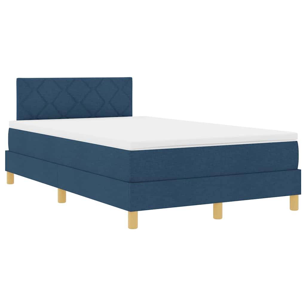 Ein blau gepolstertes Bett mit einer gesteppten Kopfseite und Holzbeinen, ausgestattet mit einer weißen Matratze. Geeignet für ein modernes Schlafzimmerambiente.