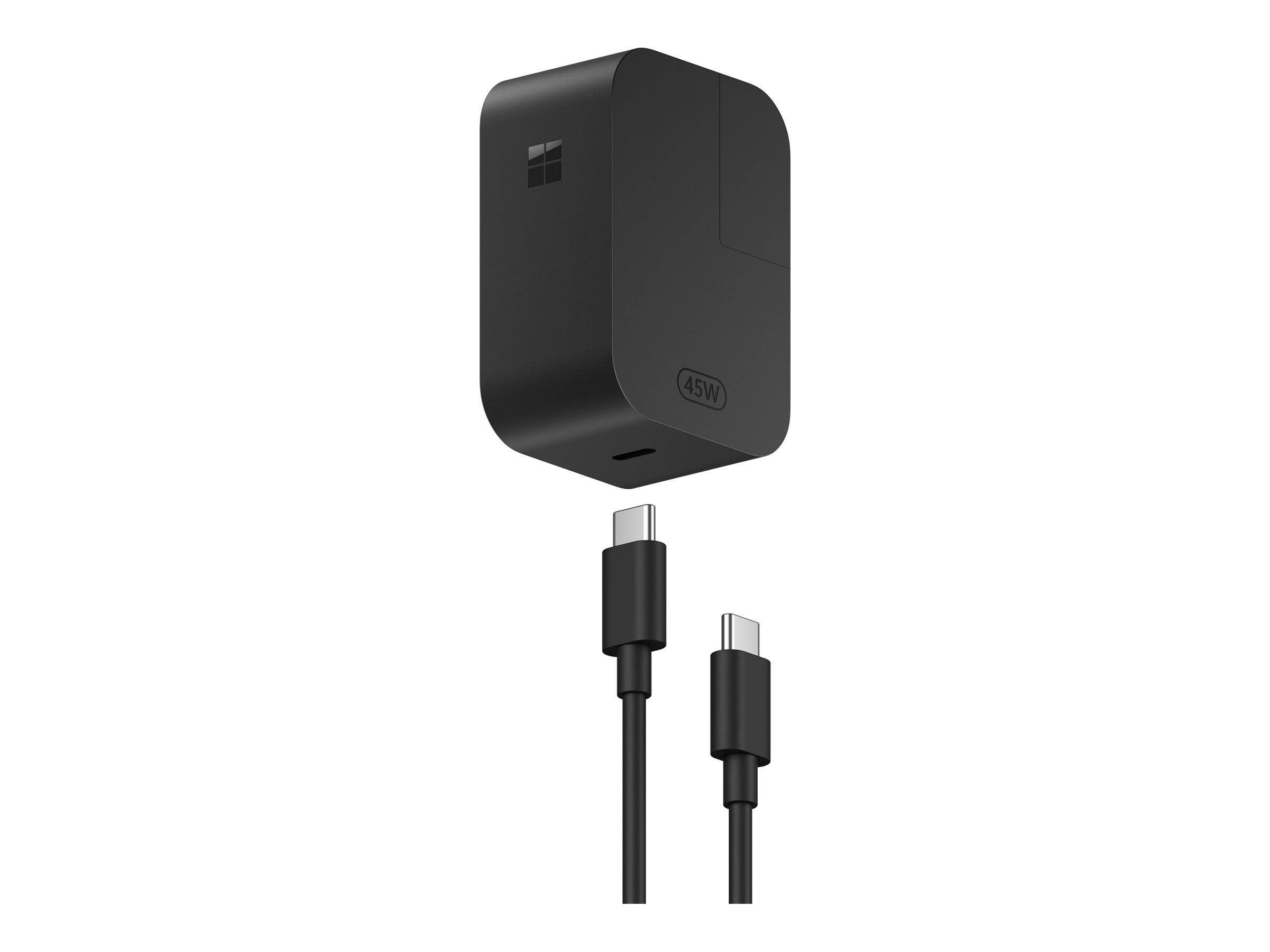 Schwarzes Microsoft-Wandladegerät mit abnehmbarem USB-C-Kabel und austauschbaren Steckerdosen-Aufsätzen auf weißem Hintergrund