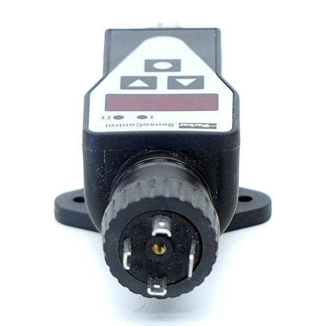 Eine Nahaufnahme eines kleinen schwarzen elektronischen Sensors oder Steuergeräts mit einem vorderen Stecker und einfachen Tasten, vor einem weißen Hintergrund gezeigt.