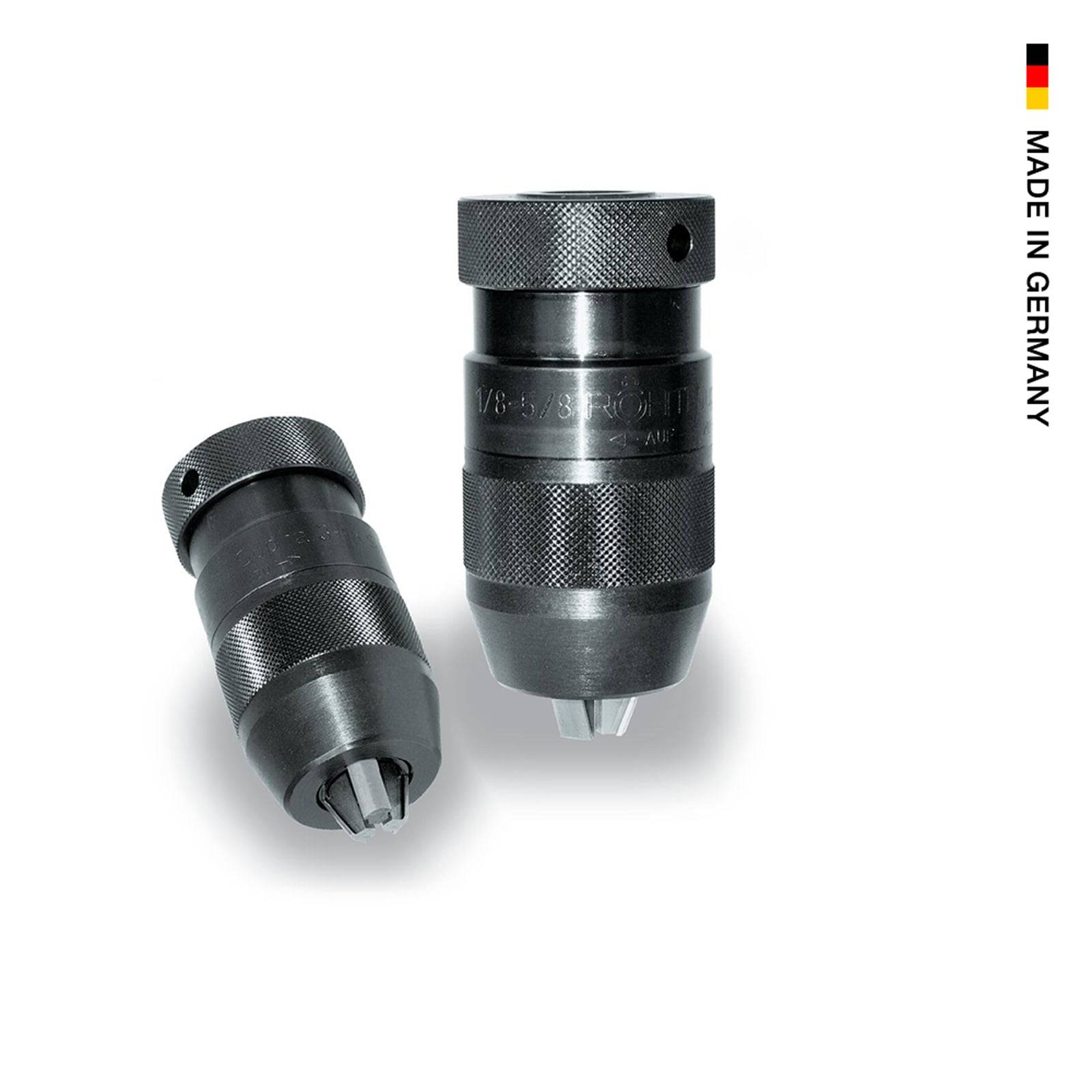 Zwei schwarze Bohrfutter aufrecht auf weißem Hintergrund positioniert mit 